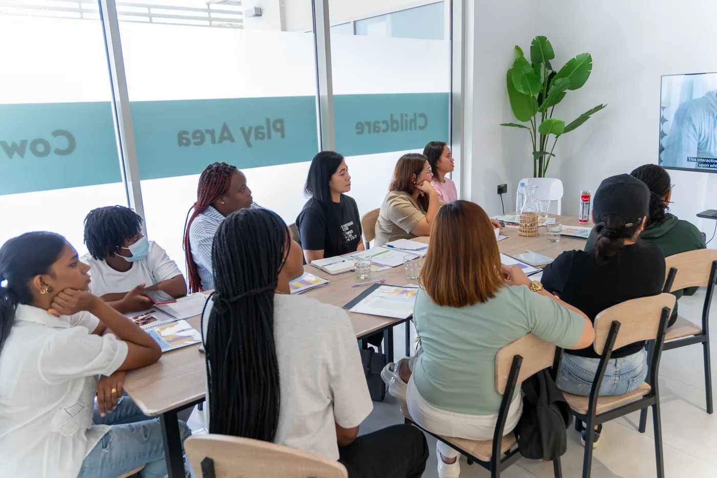 Nannies taking part in a Nova Early Years training session.